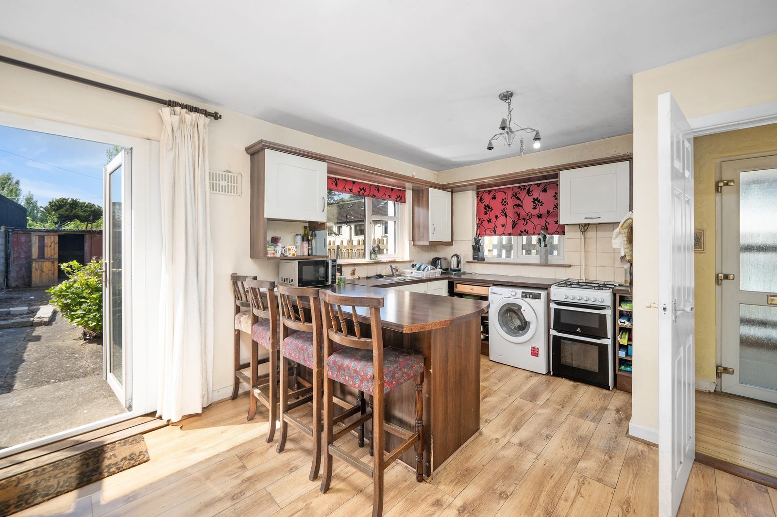 Bright kitchen with island and breakfast bar seating